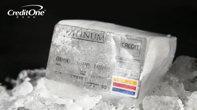 A credit card is frozen in a block of ice, representing the concept of freezing your credit.