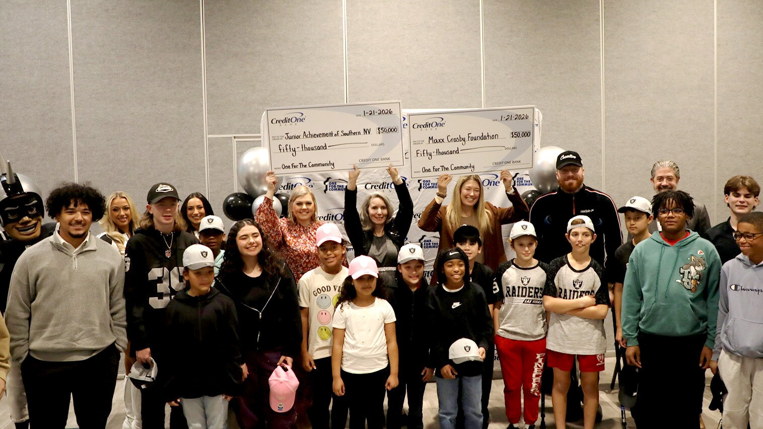 One For The Community check presentation event