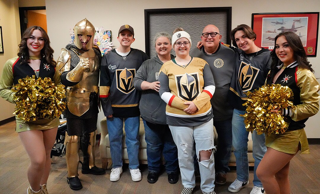 Two families from Candlelighters Childhood Cancer Foundation at the Vegas Golden Knights game with Credit One Bank