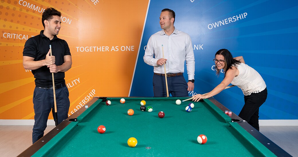 Credit One Bank employees holding up congratulatory certificates